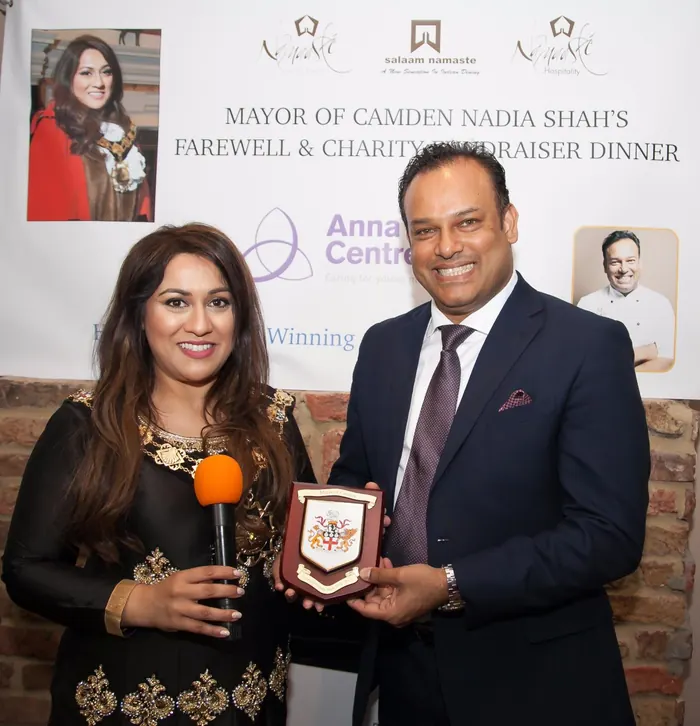Sabbir Karim receiving a plaque at the Mayor of Camden's farewell and charity fundraiser dinner