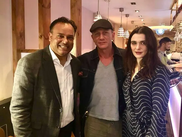 Sabbir Karim with two guests in the restaurant