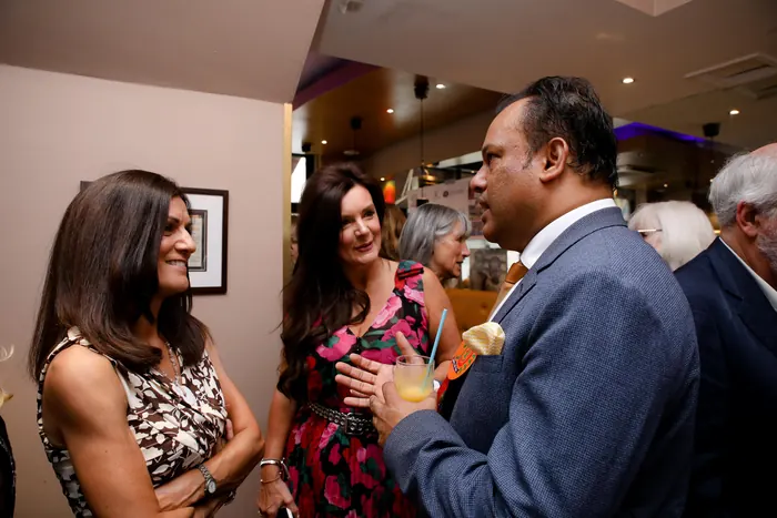 Sabbir Karim in conversation with guests at the celebration